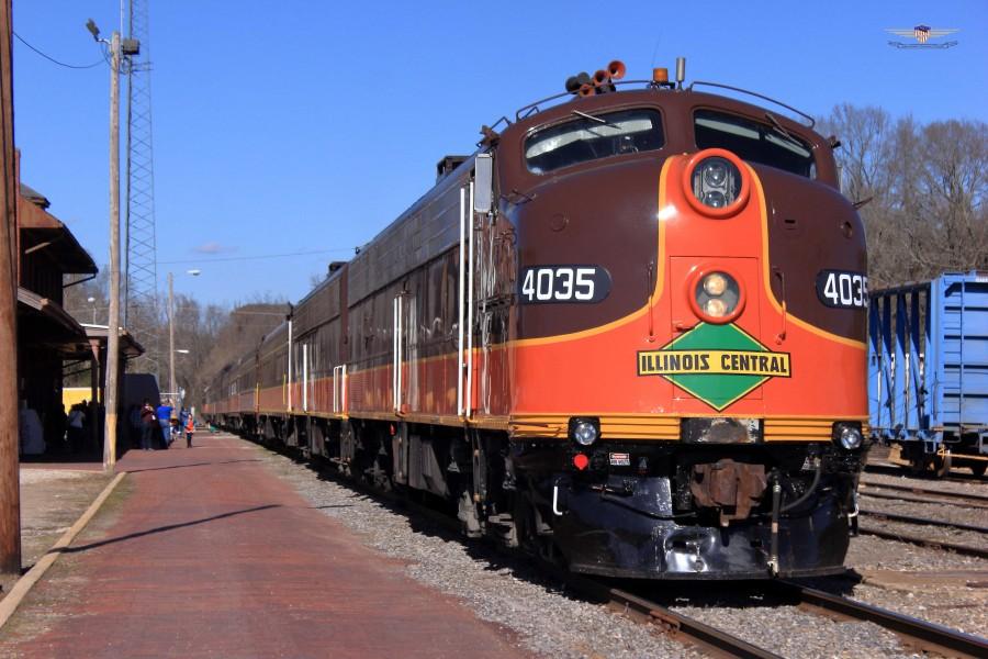 An example of Brown's locomotive photography. "Illinois Central 4035" EMD E8A pulling into Grenada Station with the City of Grenada. 63 year old locomotive.