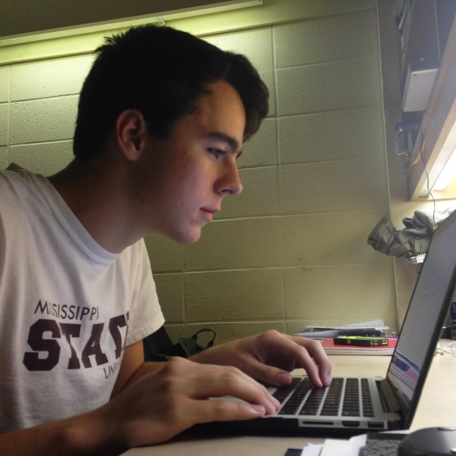 Rhet Hailey works diligently to fill out the online Common Application.
