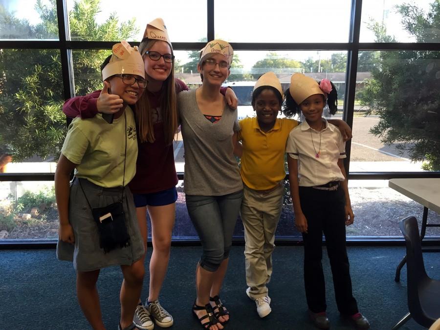 from left to right: MSMS students Joy Carino, Abby Perry, Carly Sneed, and two mentees Kamryn Ross and Madison Coleman, smiling after making each other crowns.