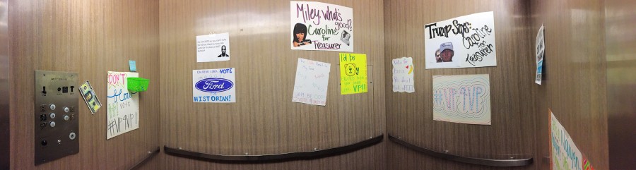 Colorful campaign posters decorate Goen Hall elevator.