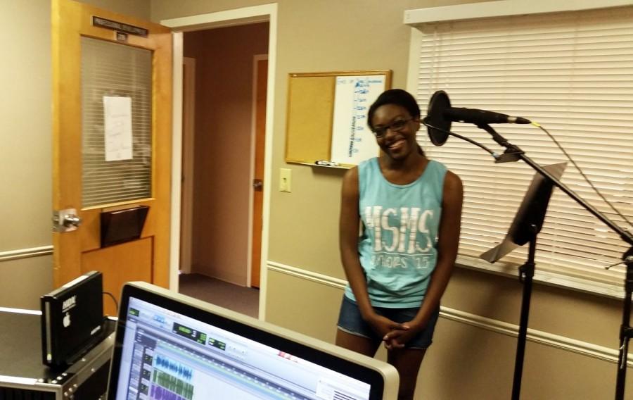 2015 MSMS graduate Sumayia Young working in the recording studio for Rural Voices Radio.
