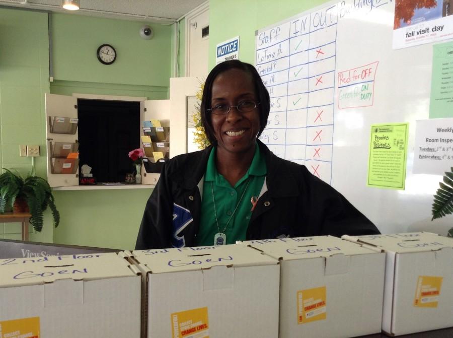  Goen Hall Director hall director LaToya Bledsoe and the Pennies for Patients collection boxes.