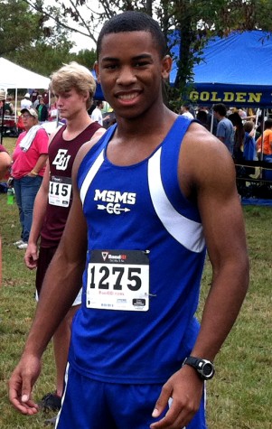 Greg Thompson waits eagerly at the starting line of a cross country meet 