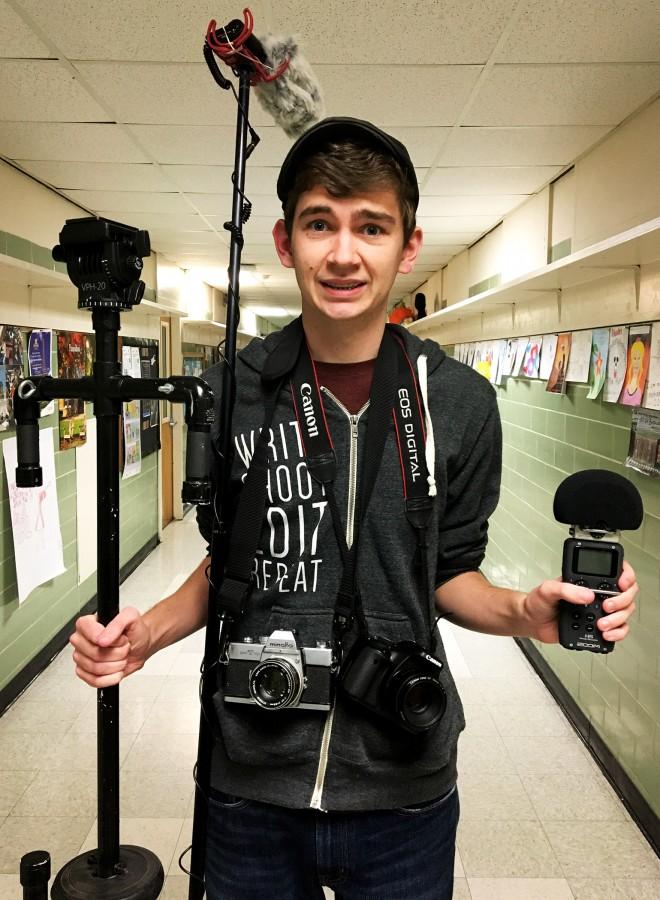 West Givens donning his film and photography equipment.
