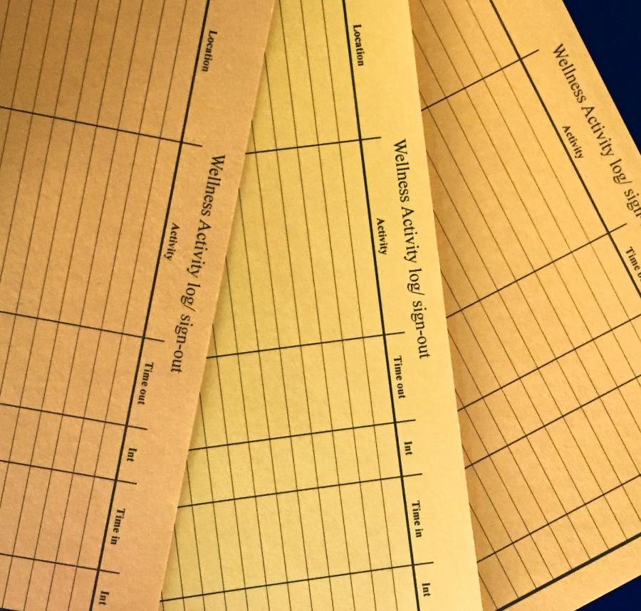 The wellness cards, known as orange cards, used by students to record their wellness hours