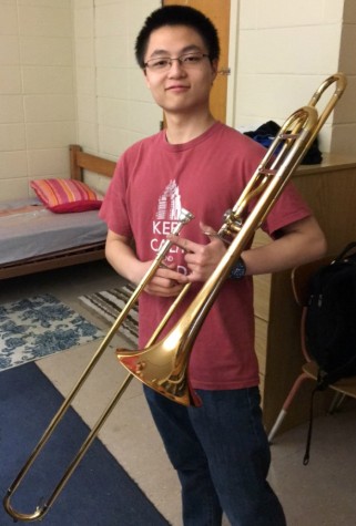 Junior Zhao poses with his trombone