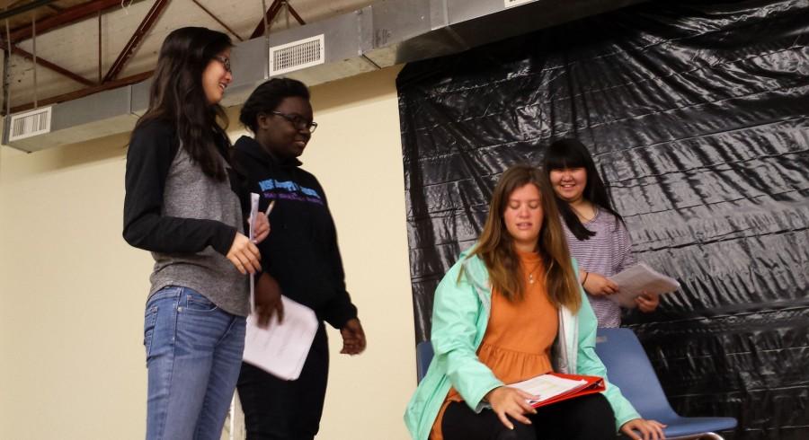  From left to right, Rebecca Chen, Tia Wilson, Maggie Ford, and Haley Hsu begin working on "It's Not Ok" 