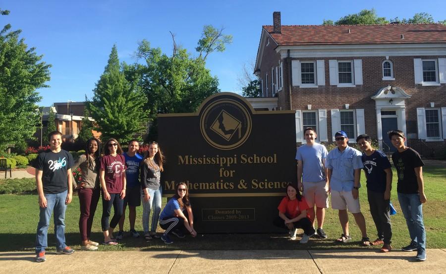 North Carolina students pose with MSMS emissaries in front of the school sign