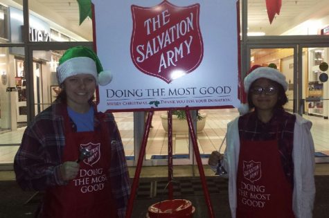 Juniors Dixie Jackson and Suchi Patel ring the bell for the Salvation Army in front of Leigh Mall 