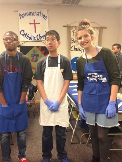 Larry Stokes, Kevin Liao, and Mary Owings prepare to serve lunch at Loaves and Fishes. 
