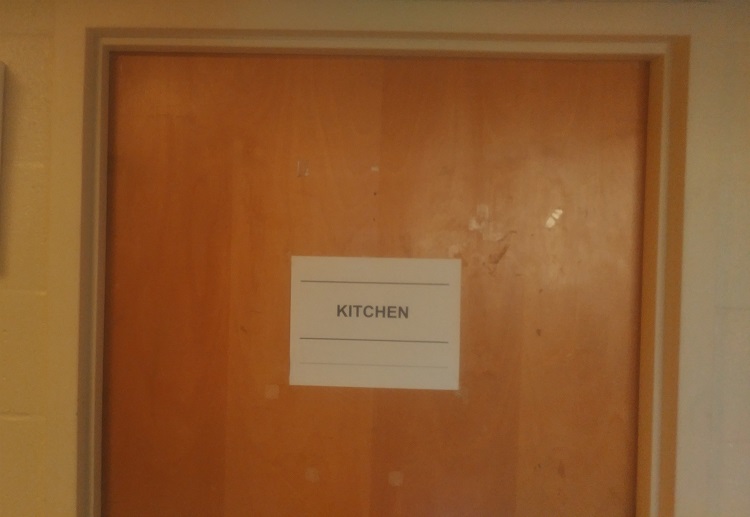 The newly taped up door of Frazer kitchen.