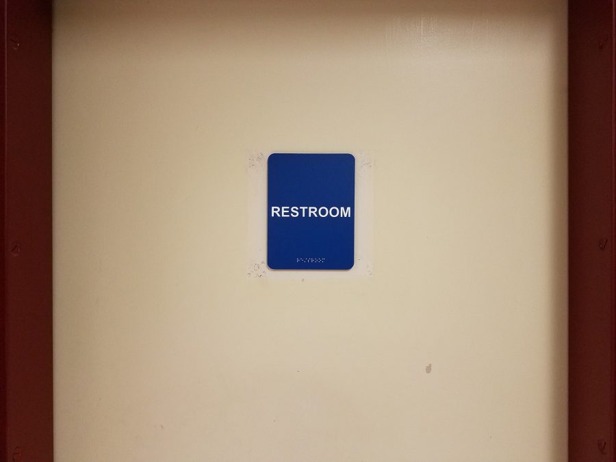 The door to the upstairs bathroom in Hooper reflects its new single-user gender-neutral status.
