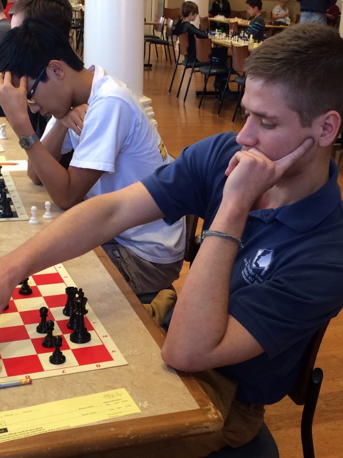 Senior Braeden Foldenauer (front) makes a move while junior Gary Nguyen ponders his own game.
