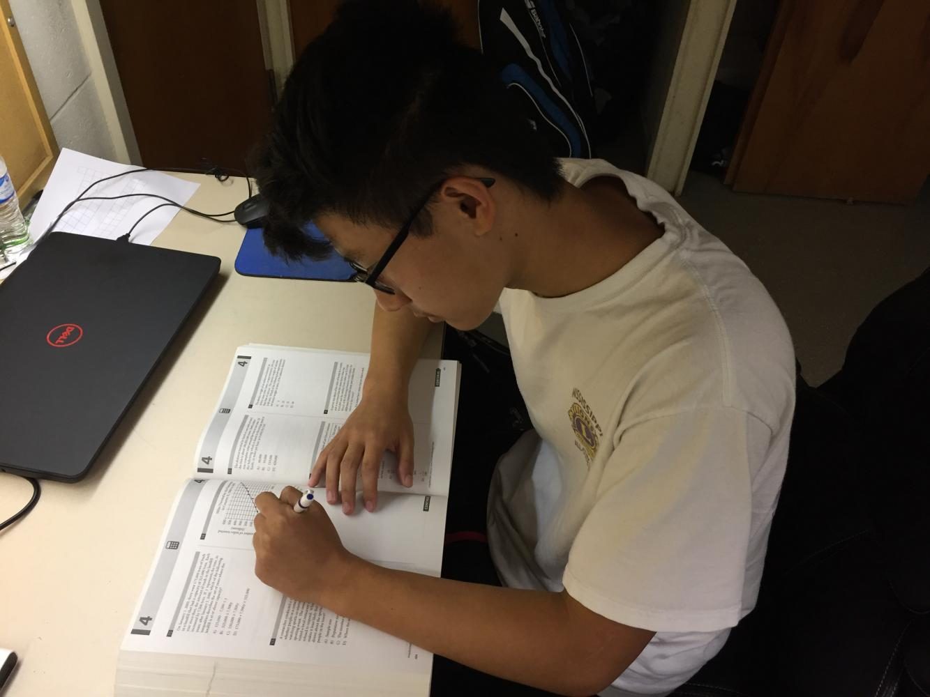 Jim Zhang prepares for his SAT test on Saturday. 