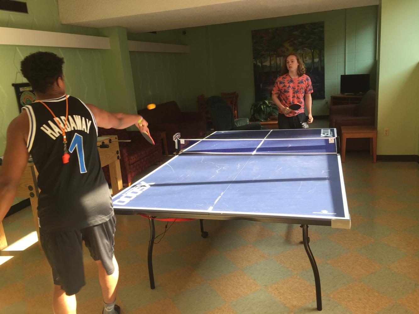 R.A.+James+Jourdan+and+junior+August+Andre+plays+a+casual+game+of+ping-pong.