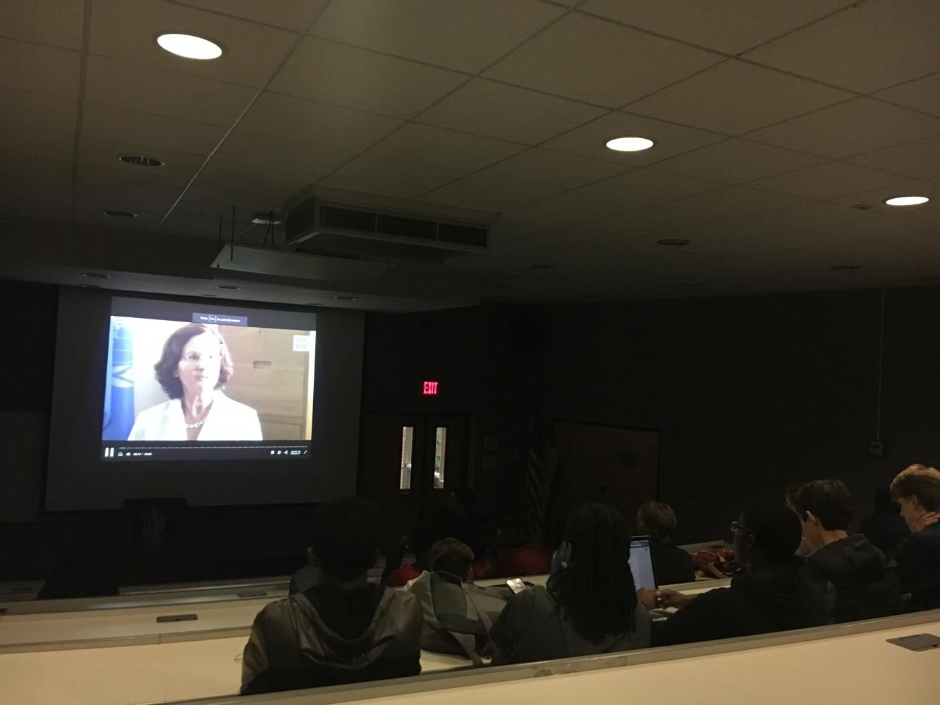 The students attentively watch the documentary on the Rohingya in Myanmar.