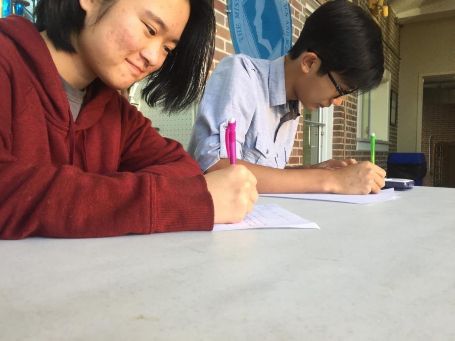Mu Alpha Theta members Michelle Luo and Gary Nguyen are hard at work at Ala-la-miss