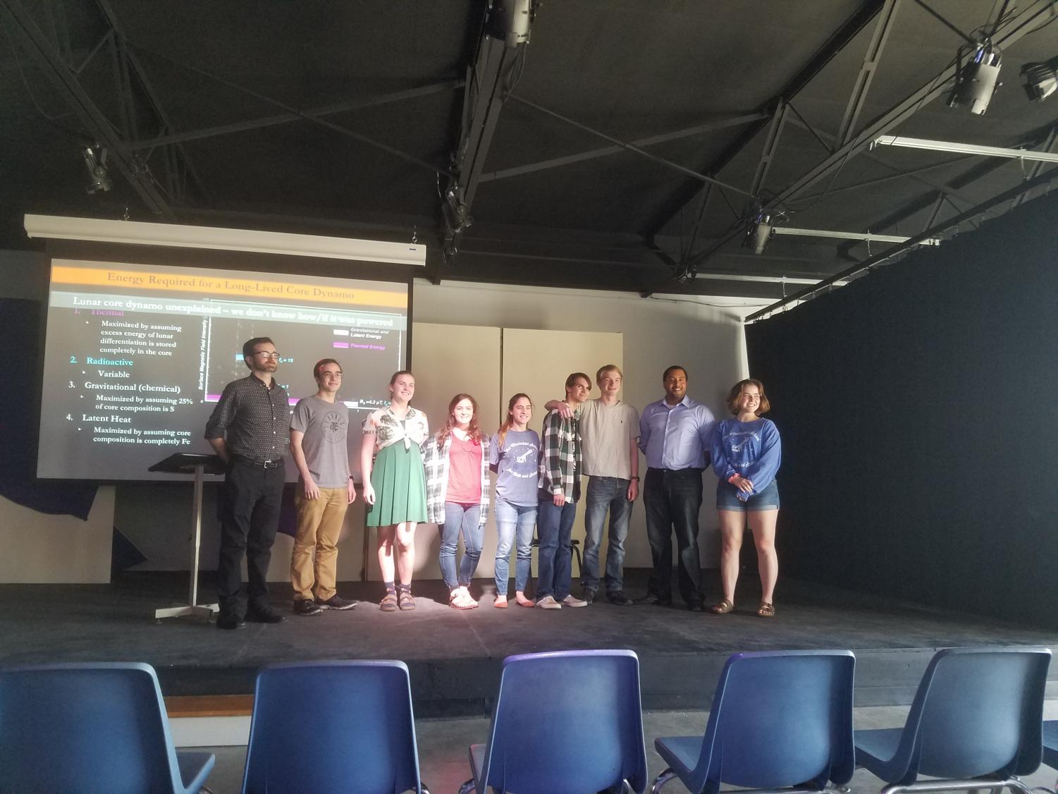Dr. Alex Evans stands with the Astronomy Club after giving a presentation on the physics of the inner solar system.
