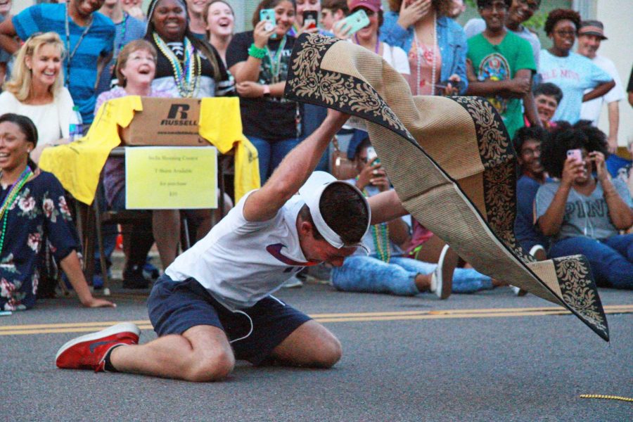 Junior Elijah Dosda screams Stella in fury as he throws the rug.