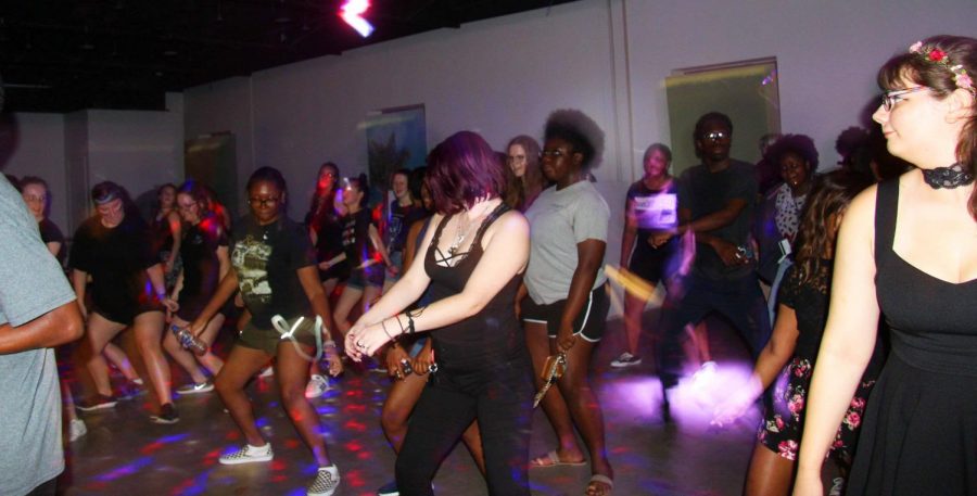 Students dance to the music at the Black Out Dance.
