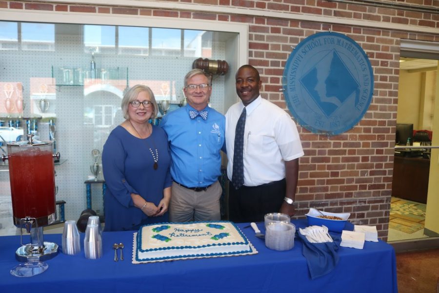 Rick Smith poses with his wife, Judy Smith, and Executive Director, Dr. Germain McConnell.