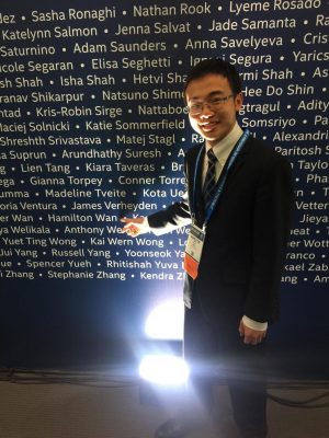 Hamilton Wan points to his name at the International Science and Engineering Fair.
