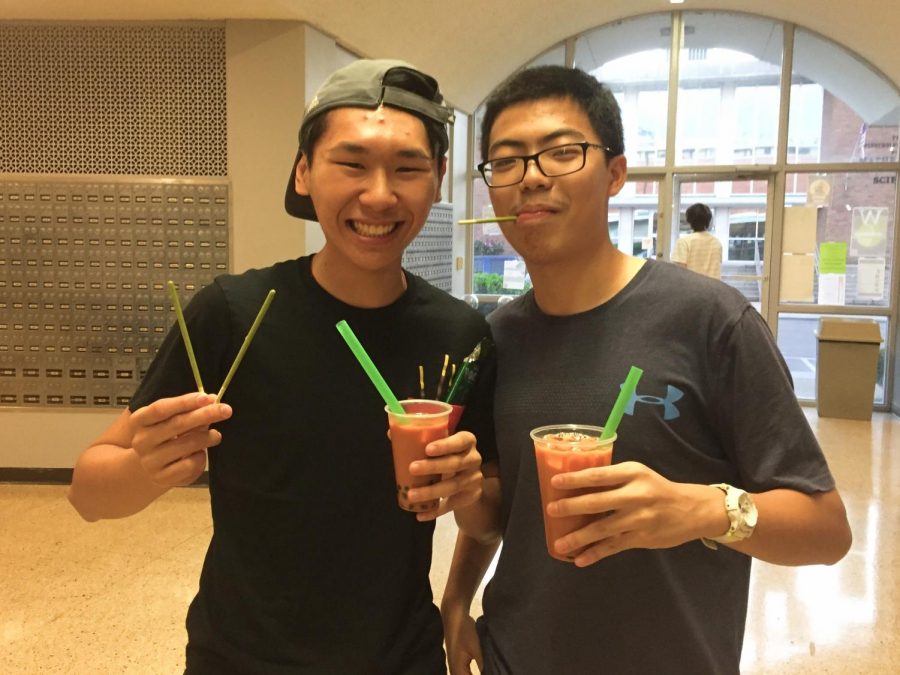 Esmond Tsang and Dennis Lee enjoy boba tea and Pocky. 