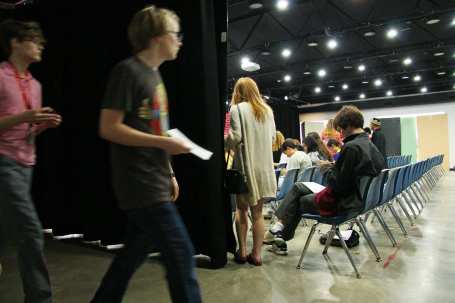 Students file in, filling up the seats, once the doors open.
