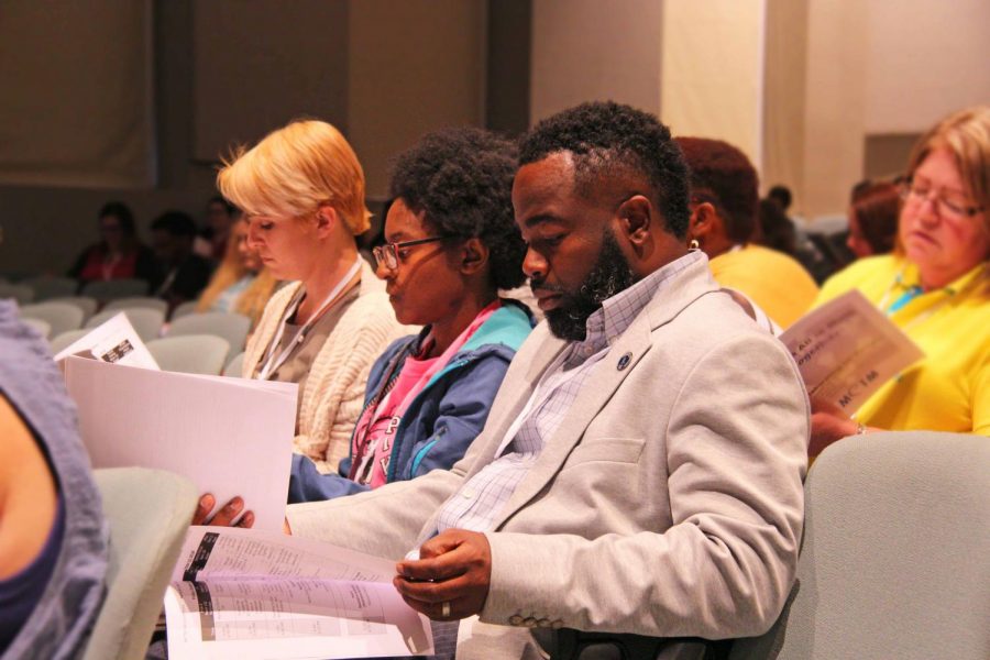 Math teachers review some handouts after attending numerous sessions.