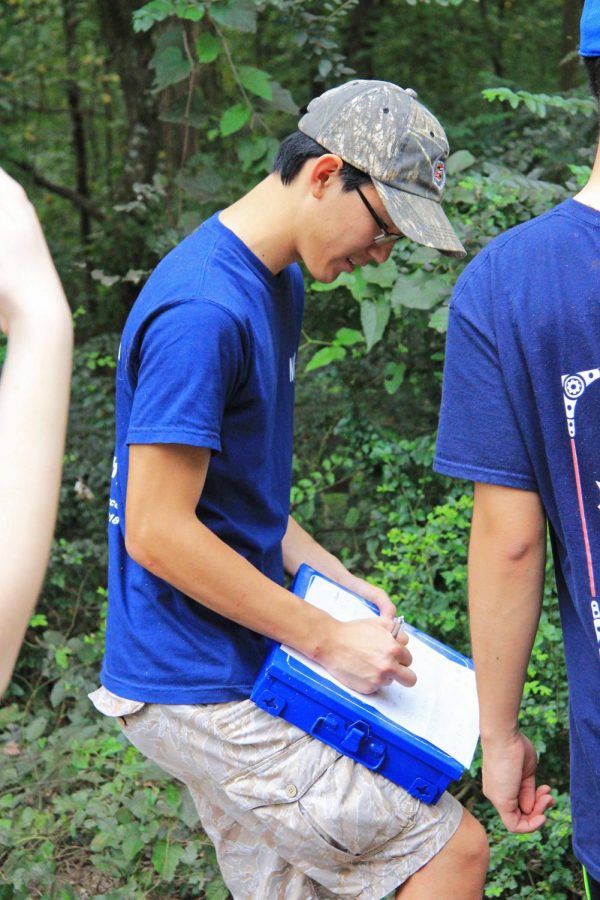 President Josh Seid keeps record of the weighted trash.