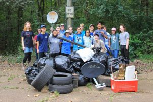 The Student Environmental Awareness League spends their Saturday morning cleaning up at the Luxapalila Creek Park.