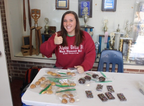 Camryn Mason sells baked goods for FCSs bake sale.