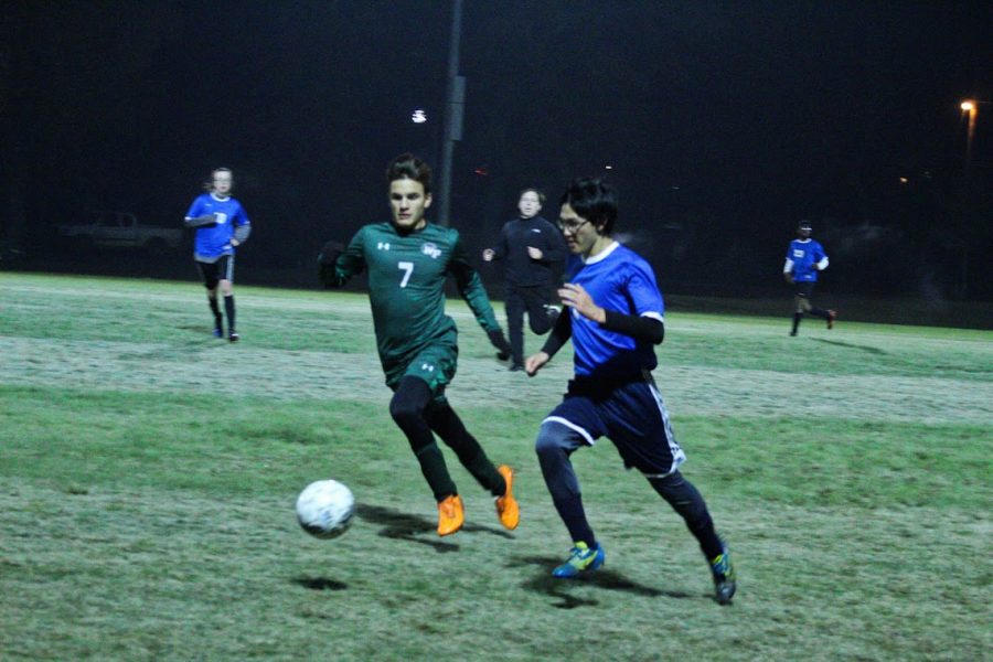 Senior Josh Seid keeps the ball from the opponent.