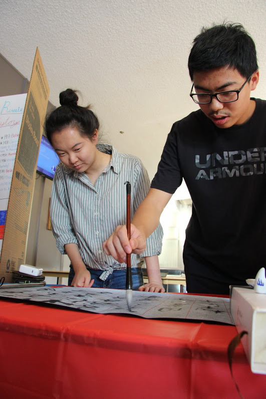 Helen Peng and Dennis Lee showcase the art of Chinese calligraphy.
