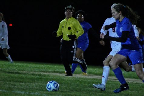 Grace Ann Beech fights the opposing team to maintain control of the ball.