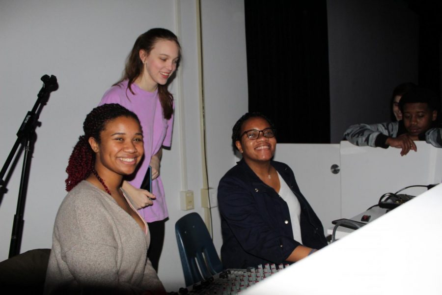 Left to right: Samantha Anderson, Emily Penton, and Mia Ridley set up the music for the dance.