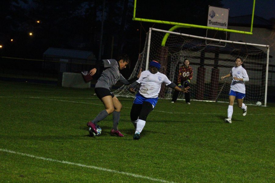 The Lady Waves try to defend from Choctaw High.