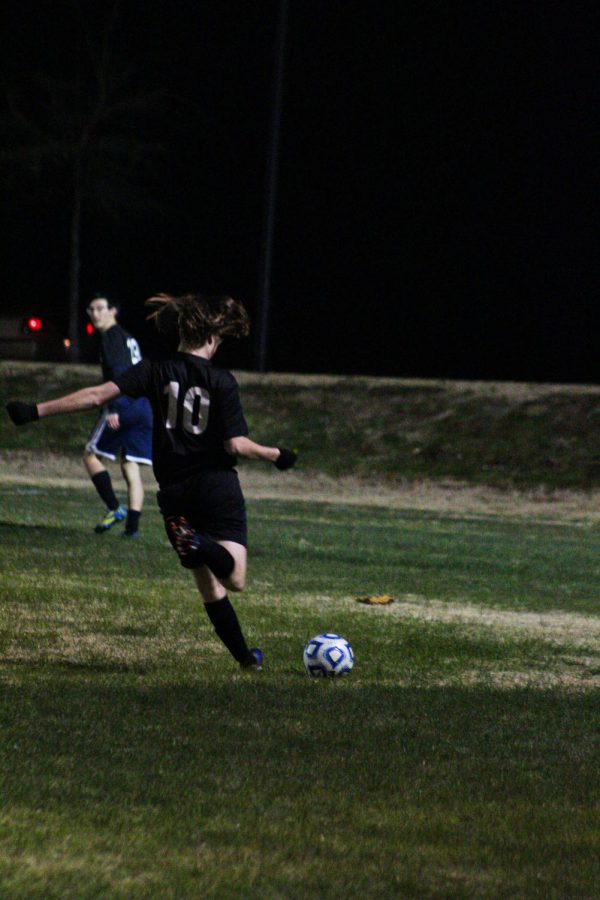 Josiah "JoJo" Kaler punts the ball after a foul was called on the other team.