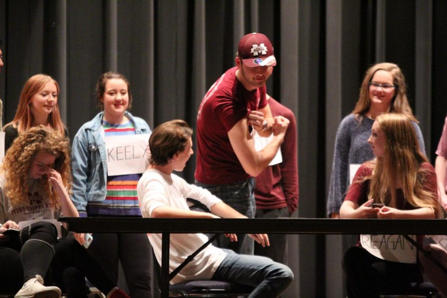 Junior Dylan Johnson (center) as Tate Howard