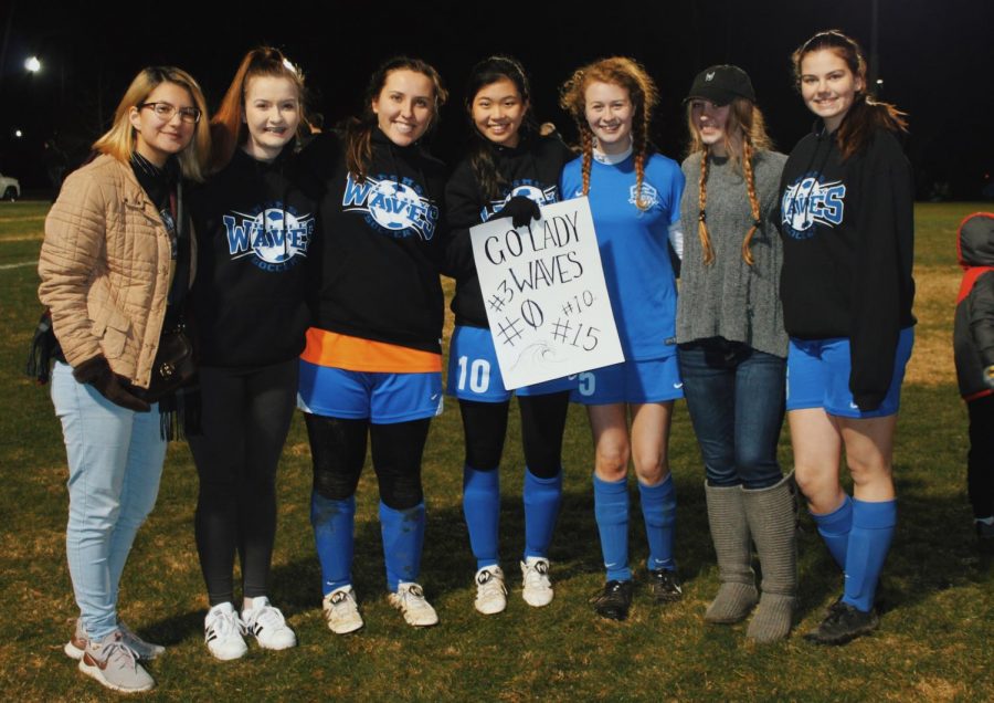 Lady Waves beam after their last game.