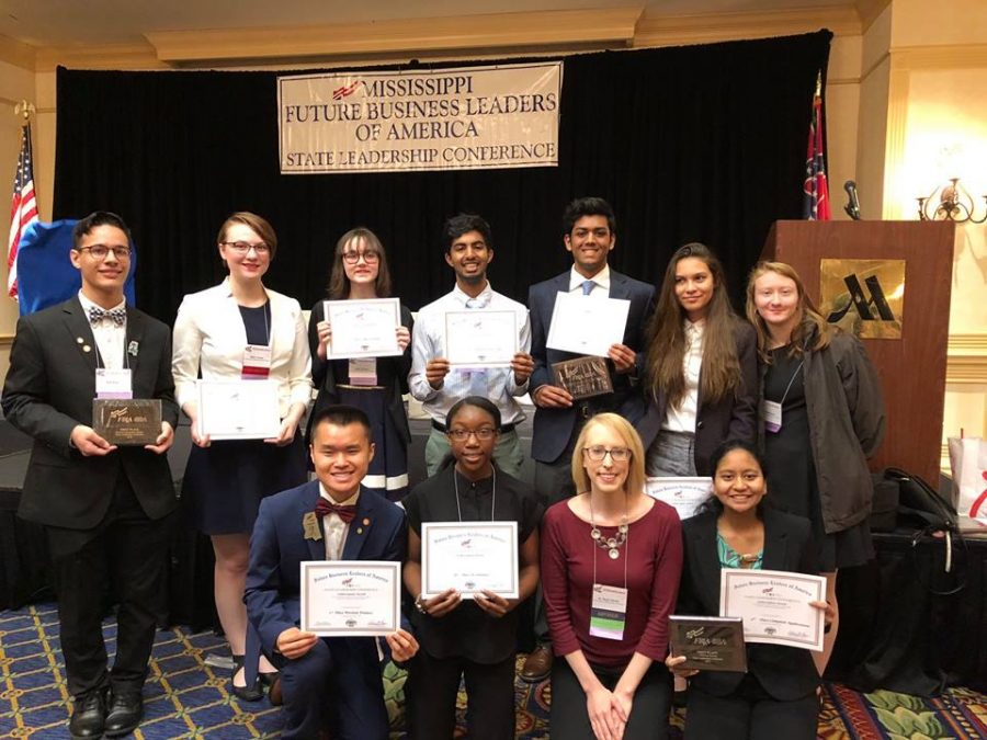 Hester (front row, second from right) pictured with students at the State Leadership Conference for Mississippis Future Business Leaders of America.