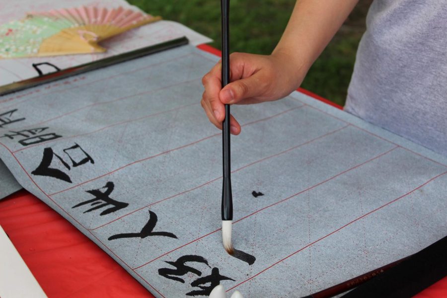 China's representatives demonstrate Chinese calligraphy.