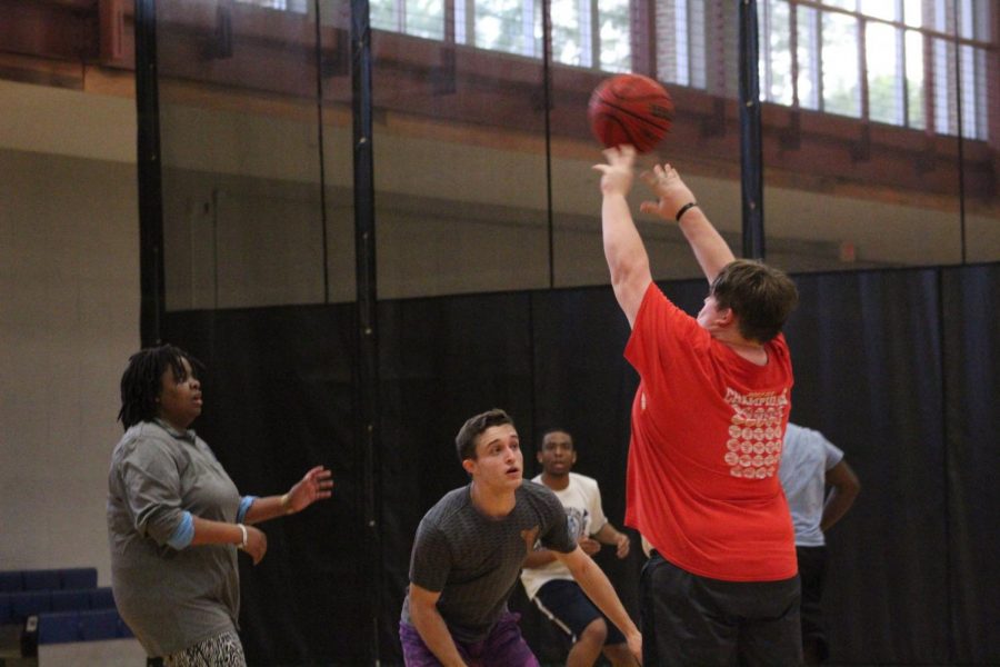 Russ Thompson shoots as RA Jon Beadlescomb tries to block.