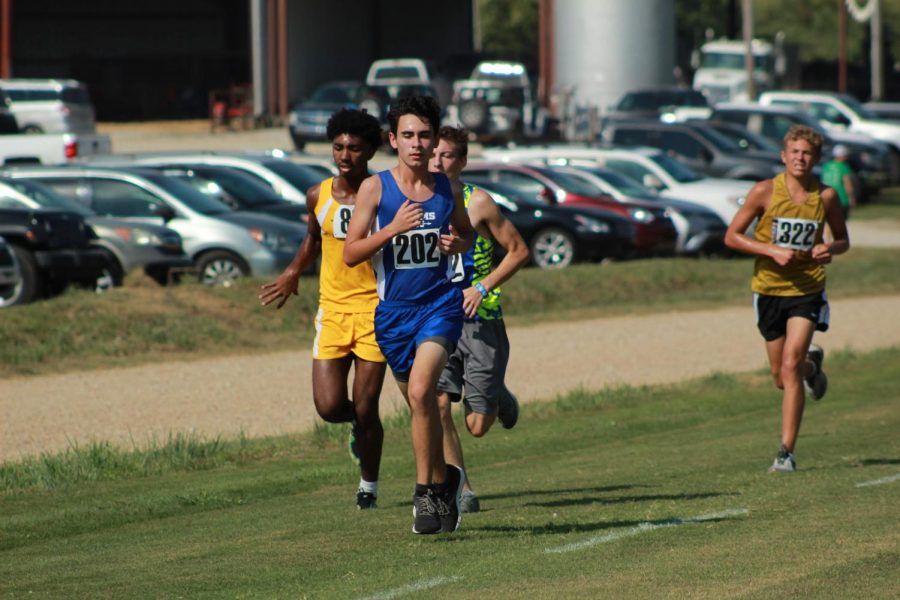 Junior Chandler Bryant keeps his eyes on the finish line and passes up several runners.