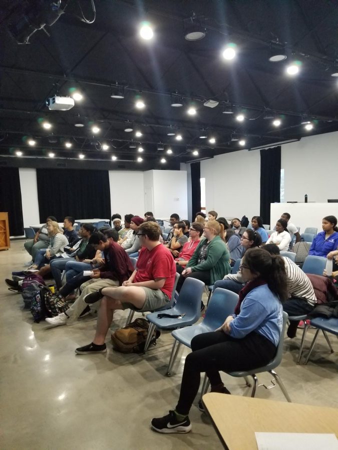 Students listen to a financial literacy presentation in Shackleford Auditorium.