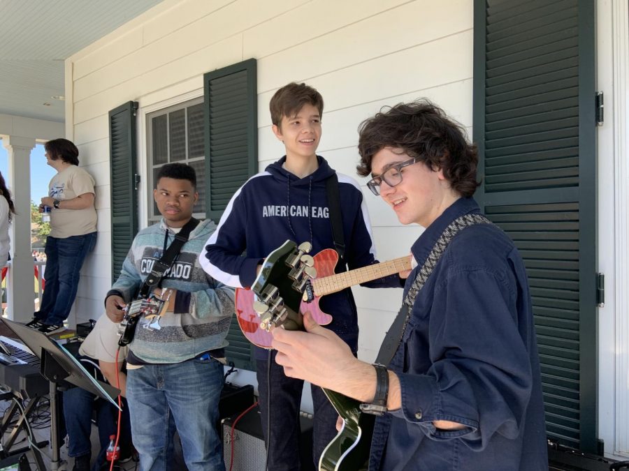 Juniors Zach Medlin (guitar), Henry Sanders (guitar), and Brayden Bailey (bass) make up some of the rhythm section and jam out before a performance.