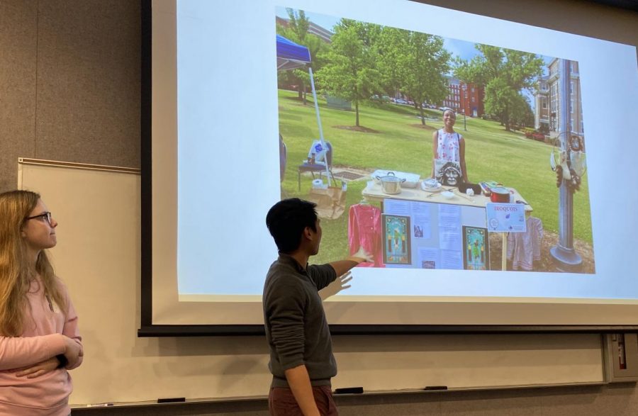 ICF coordinators Clara Grady and Esmond Tsang showing pictures of the 2019 ICF. 