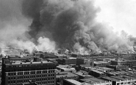 An image of the Tulsa Race Riot that killed over 300 people despite never  being taught before in Oklahoma schools. 