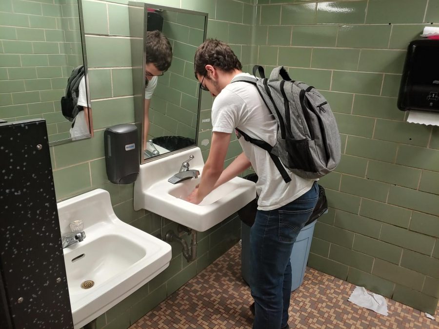 Senior David Johnson washes hands, following general guidelines provided by MSMS administration and staff. Other precautions recommended by the Center for Disease Control (CDC) include avoiding sick people and avoiding touching ones eyes, nose or mouth.