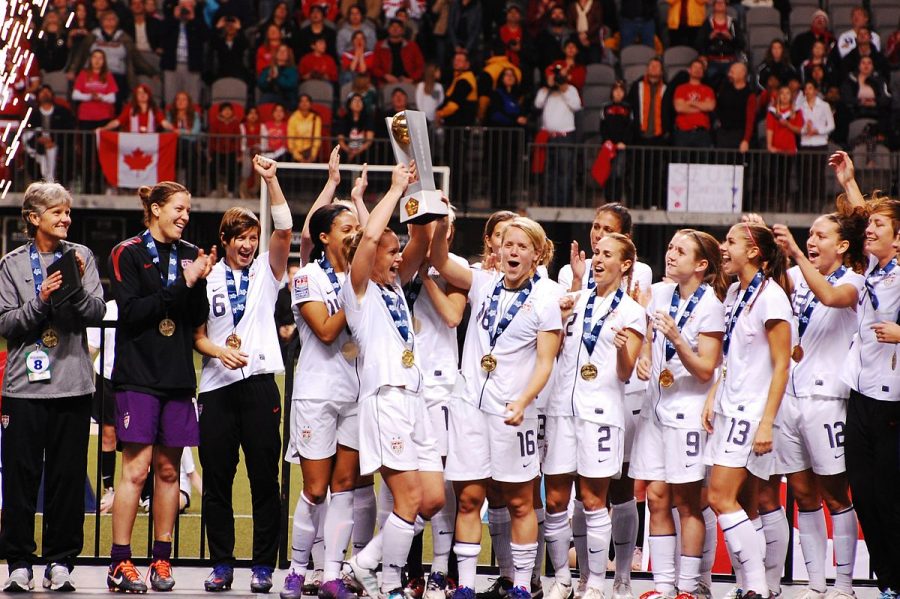 The USWNT celebrates after their first place finish in the 2012 Olympic Qualifiers. 